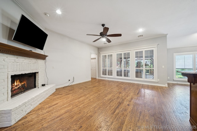4205 N Narcissus Ave, Broken Arrow, OK 74012 - unfurnished living room with a fireplace, ceiling fan, ornamental molding, wood finished floors, and recessed lighting