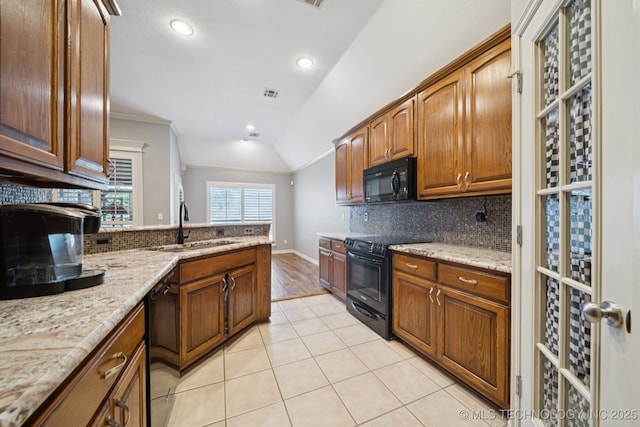 4205 N Narcissus Ave, Broken Arrow, OK 74012 - kitchen with black appliances, backsplash, light stone countertops, light tile patterned floors, and crown molding
