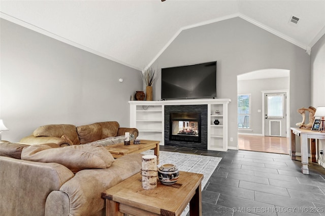 8905 N 137th E Ave, Owasso, OK 74055 - living room with arched walkways, a multi sided fireplace, lofted ceiling, and ornamental molding