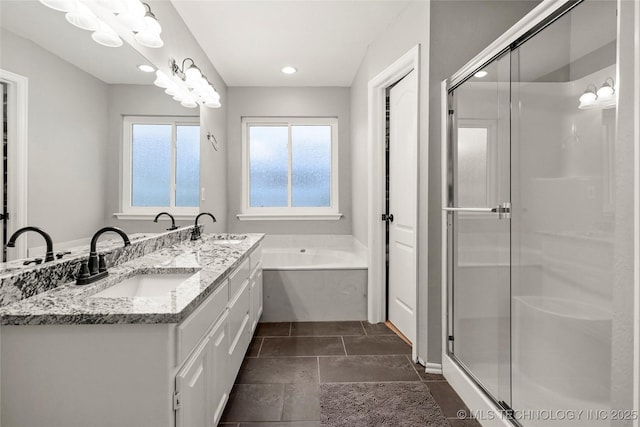 8905 N 137th E Ave, Owasso, OK 74055 - full bathroom featuring double vanity, a bath, a stall shower, recessed lighting, and tile patterned flooring
