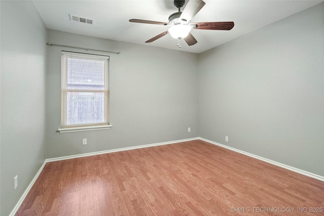 8905 N 137th E Ave, Owasso, OK 74055 - empty room featuring wood finished floors and ceiling fan