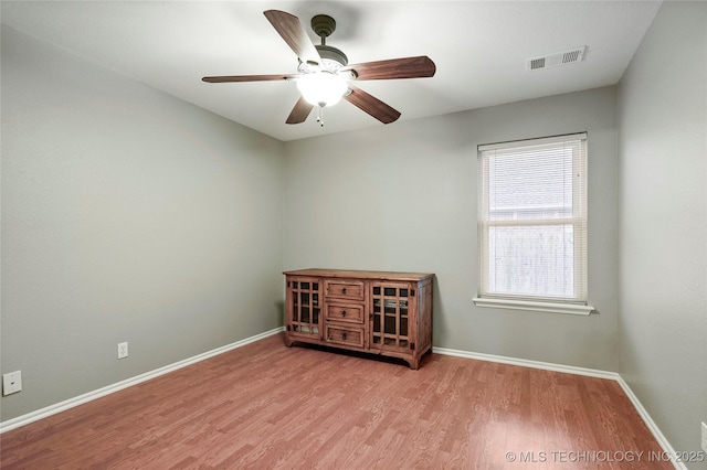 8905 N 137th E Ave, Owasso, OK 74055 - spare room featuring wood finished floors and ceiling fan