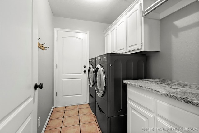 8905 N 137th E Ave, Owasso, OK 74055 - laundry room featuring independent washer and dryer, cabinet space, and light tile patterned floors