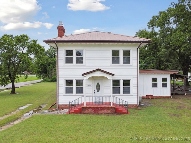 1601 E 6th St, Okmulgee, OK 74447 - traditional style home with a chimney, crawl space, a front yard, and a metal roof