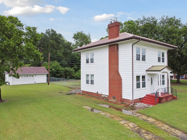1601 E 6th St, Okmulgee, OK 74447 - back of house featuring crawl space, a chimney, and a metal roof