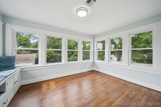 1601 E 6th St, Okmulgee, OK 74447 - unfurnished sunroom with hardwood / wood-style flooring and baseboards