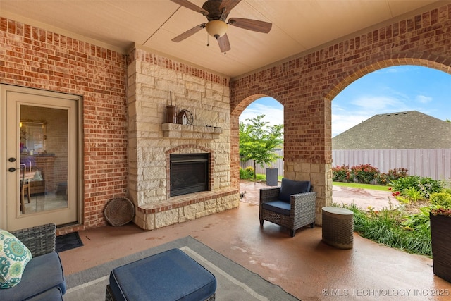 800 Magnolia, Ada, OK 74820 - view of patio with an outdoor stone fireplace and a ceiling fan