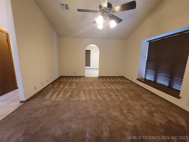 428101 E 1150th Rd, Porum, OK 74455 - carpeted empty room with vaulted ceiling, arched walkways, and a ceiling fan