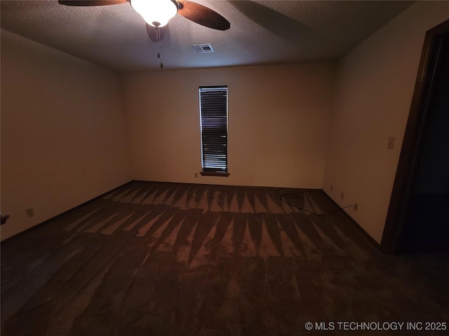 428101 E 1150th Rd, Porum, OK 74455 - carpeted spare room with a ceiling fan and a textured ceiling