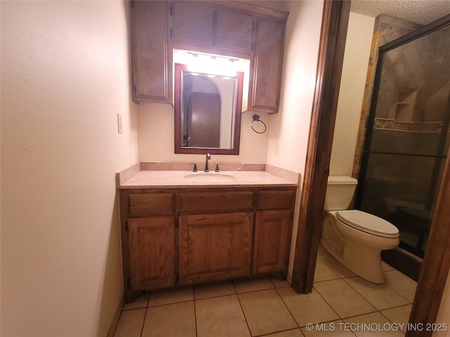 428101 E 1150th Rd, Porum, OK 74455 - bathroom with a shower stall, vanity, tile patterned flooring, and a textured ceiling