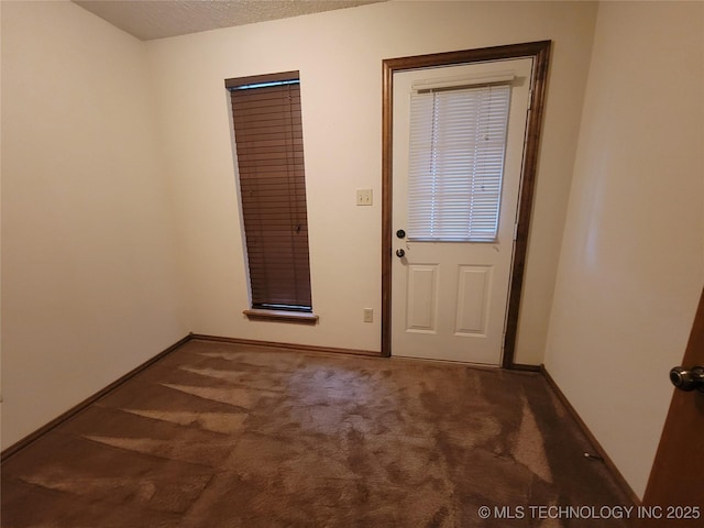 428101 E 1150th Rd, Porum, OK 74455 - entryway with carpet and baseboards