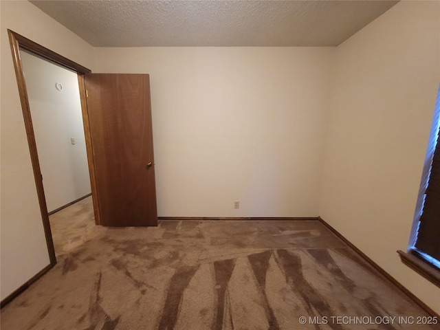 428101 E 1150th Rd, Porum, OK 74455 - unfurnished bedroom with carpet flooring and a textured ceiling