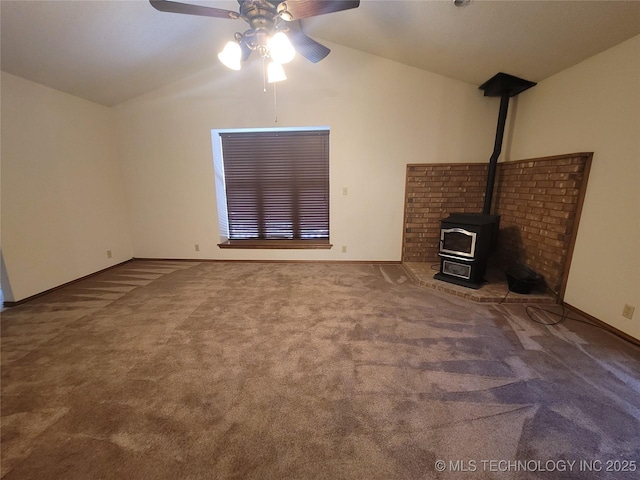428101 E 1150th Rd, Porum, OK 74455 - unfurnished living room with lofted ceiling, a wood stove, a ceiling fan, and carpet floors