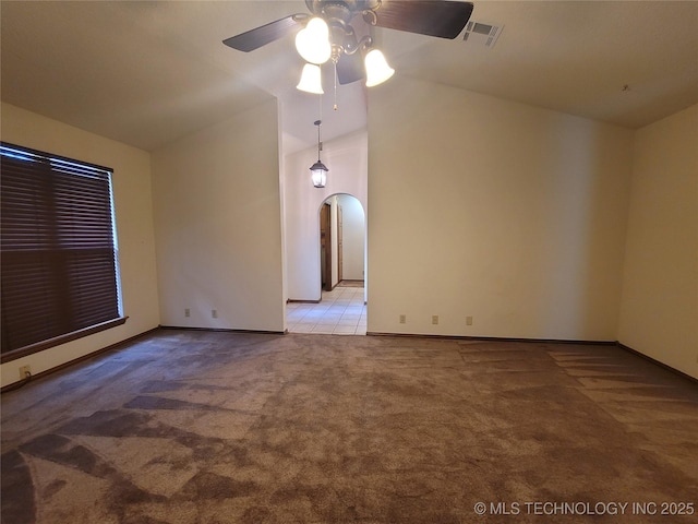 428101 E 1150th Rd, Porum, OK 74455 - spare room with light colored carpet, arched walkways, a ceiling fan, and lofted ceiling