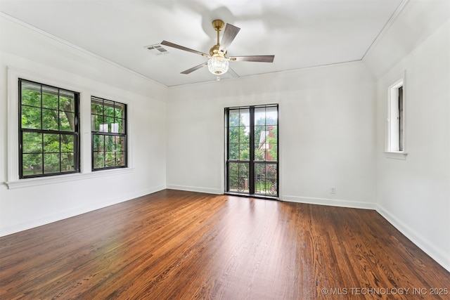 2605 S St Louis Ave, Tulsa, OK 74114 - empty room featuring plenty of natural light, wood finished floors, a ceiling fan, and ornamental molding