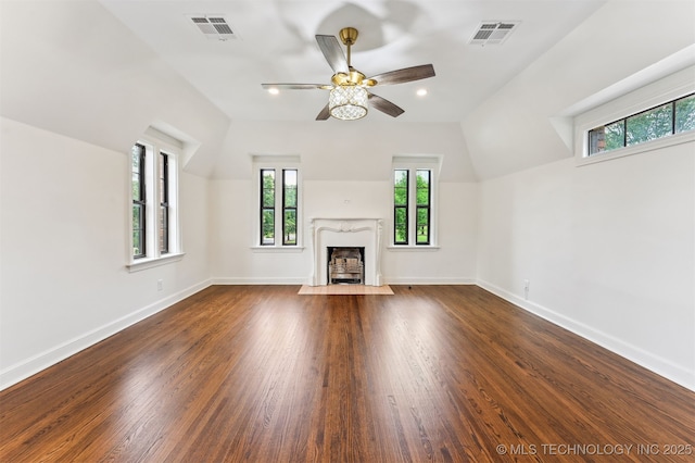 2605 S St Louis Ave, Tulsa, OK 74114 - unfurnished living room with healthy amount of natural light, a high end fireplace, ceiling fan, dark wood-style flooring, and recessed lighting