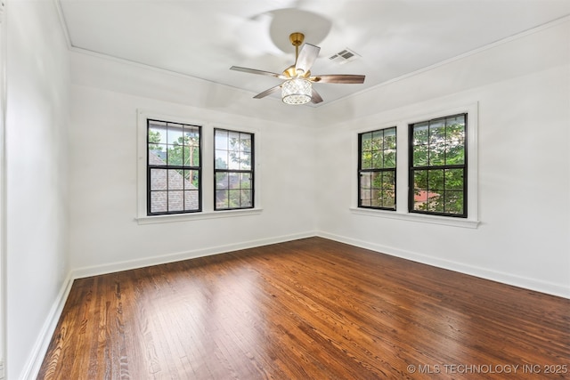 2605 S St Louis Ave, Tulsa, OK 74114 - unfurnished room featuring plenty of natural light, a ceiling fan, dark wood finished floors, and ornamental molding