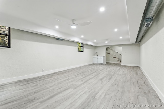2605 S St Louis Ave, Tulsa, OK 74114 - below grade area with recessed lighting, light wood finished floors, ceiling fan, and stairway