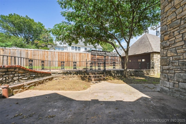 2605 S St Louis Ave, Tulsa, OK 74114 - fenced backyard featuring a patio area