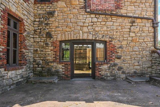 2605 S St Louis Ave, Tulsa, OK 74114 - view of exterior entry with stone siding and brick siding