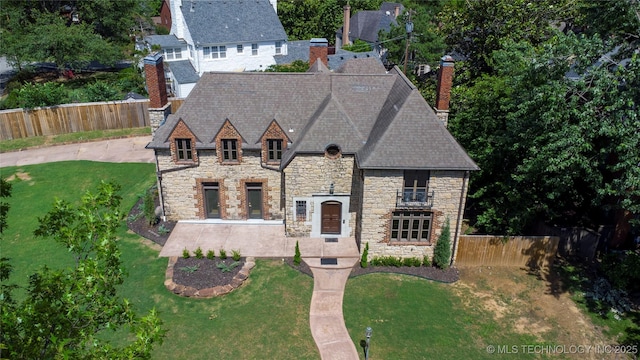 2605 S St Louis Ave, Tulsa, OK 74114 - view of front of home with stone siding and a chimney