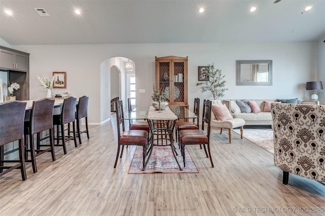 1914 W Imperial St, Broken Arrow, OK 74011 - dining space with arched walkways, light wood-style flooring, and recessed lighting