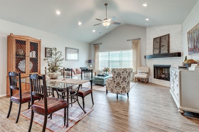 1914 W Imperial St, Broken Arrow, OK 74011 - dining room featuring ceiling fan, light wood-type flooring, a fireplace, recessed lighting, and high vaulted ceiling