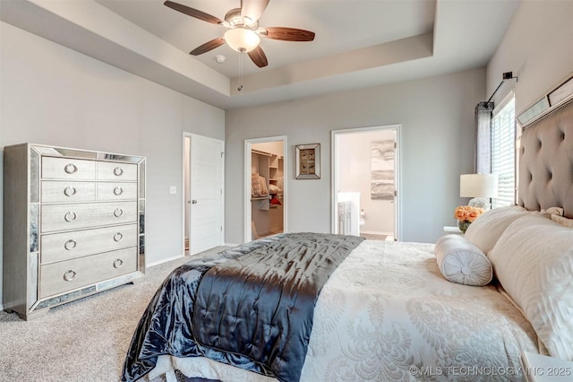 1914 W Imperial St, Broken Arrow, OK 74011 - bedroom with carpet flooring, a walk in closet, ensuite bath, ceiling fan, and a tray ceiling