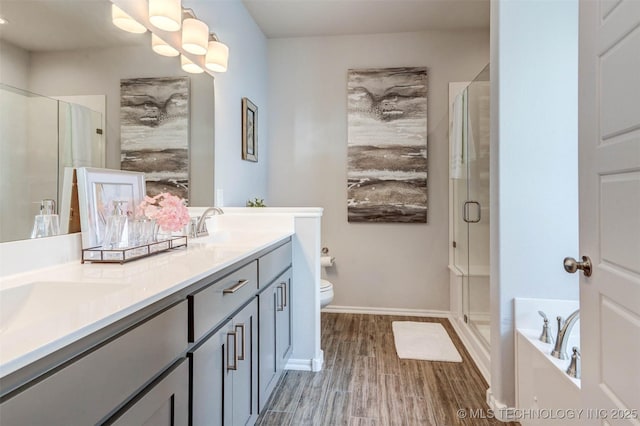 1914 W Imperial St, Broken Arrow, OK 74011 - bathroom with a shower stall, double vanity, wood finished floors, and a bath