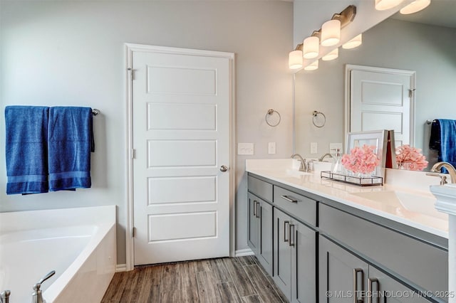 1914 W Imperial St, Broken Arrow, OK 74011 - full bathroom featuring wood finished floors, double vanity, and a garden tub