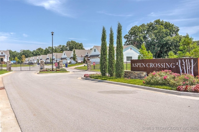 1914 W Imperial St, Broken Arrow, OK 74011 - view of asphalt street with street lighting, curbs, a residential view, a gated entry, and a gate