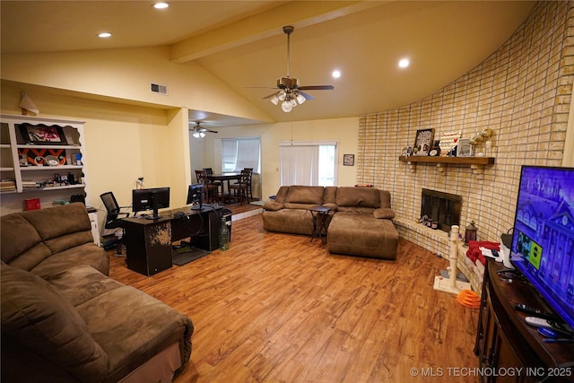 2613 Turner St, Muskogee, OK 74403 - living area featuring wood finished floors, a brick fireplace, ceiling fan, and recessed lighting