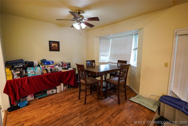 2613 Turner St, Muskogee, OK 74403 - dining room featuring a ceiling fan and wood finished floors