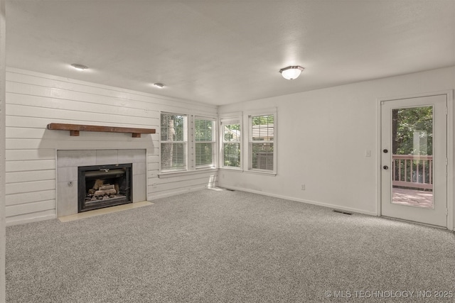 5117 S Lions Ave, Broken Arrow, OK 74011 - unfurnished living room with carpet and a tiled fireplace
