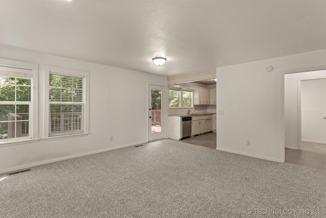 5117 S Lions Ave, Broken Arrow, OK 74011 - unfurnished living room with a sink and light colored carpet