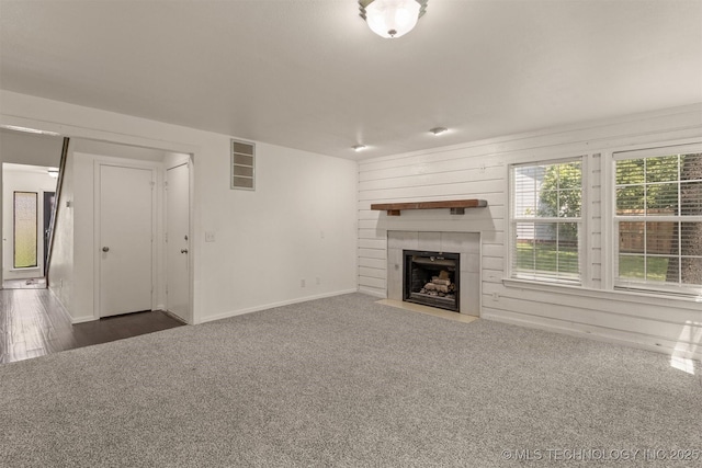 5117 S Lions Ave, Broken Arrow, OK 74011 - unfurnished living room with a fireplace and carpet
