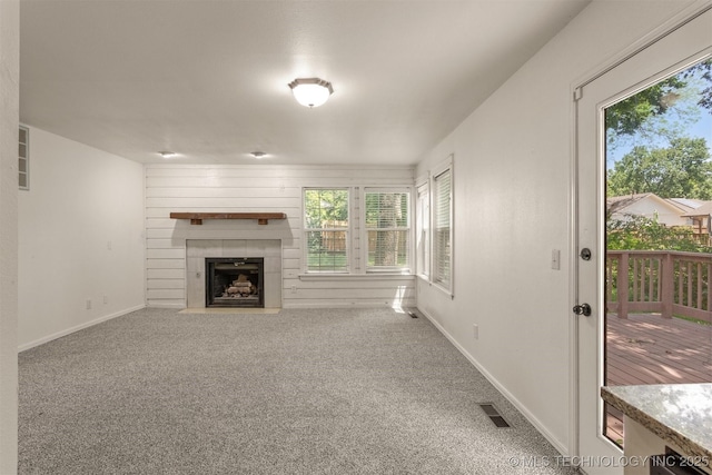 5117 S Lions Ave, Broken Arrow, OK 74011 - unfurnished living room featuring a fireplace and carpet floors