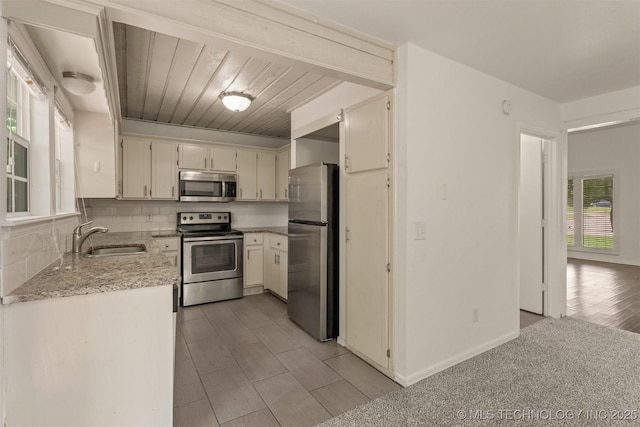5117 S Lions Ave, Broken Arrow, OK 74011 - kitchen featuring appliances with stainless steel finishes, decorative backsplash, and light stone counters