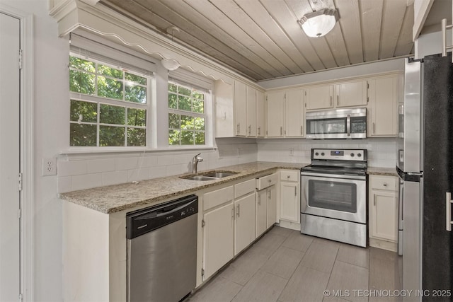 5117 S Lions Ave, Broken Arrow, OK 74011 - kitchen with stainless steel appliances, backsplash, wood ceiling, light tile patterned flooring, and light stone counters