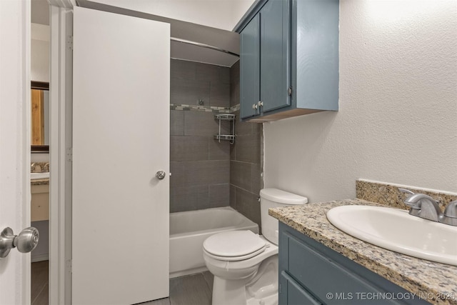 5117 S Lions Ave, Broken Arrow, OK 74011 - bathroom with vanity, bathtub / shower combination, and a textured wall