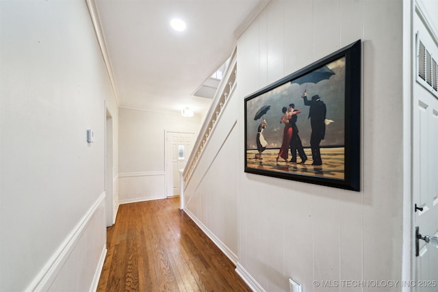 1210 E 15th St, Ada, OK 74820 - corridor featuring wood finished floors, ornamental molding, stairway, and a decorative wall