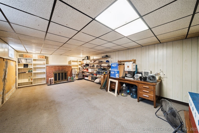 1210 E 15th St, Ada, OK 74820 - carpeted office space with a fireplace, wooden walls, and a drop ceiling