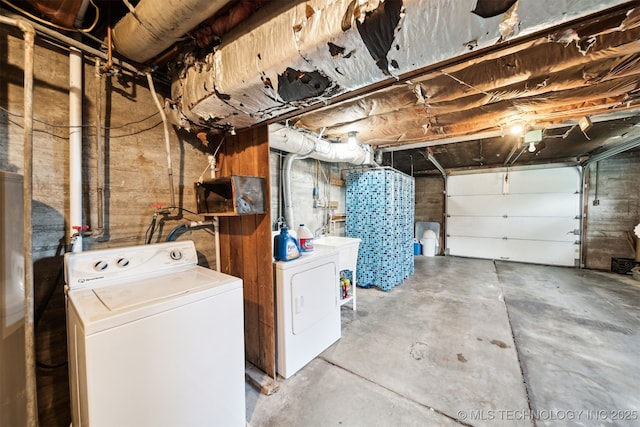 1210 E 15th St, Ada, OK 74820 - basement featuring washer and clothes dryer and a garage