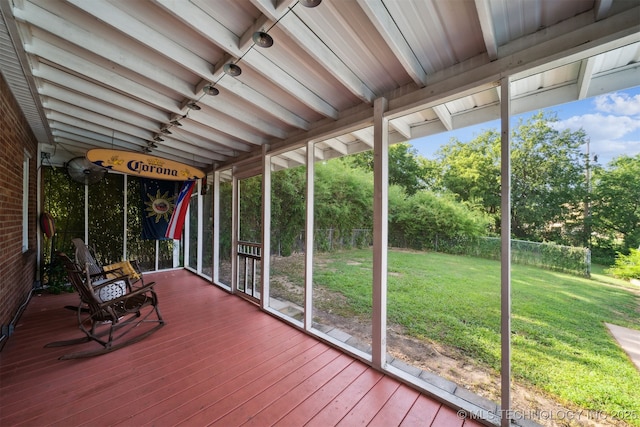 1210 E 15th St, Ada, OK 74820 - unfurnished sunroom featuring track lighting