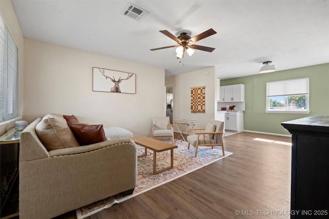 321 NE Elmhurst Ave, Bartlesville, OK 74006 - living area featuring wood finished floors and a ceiling fan