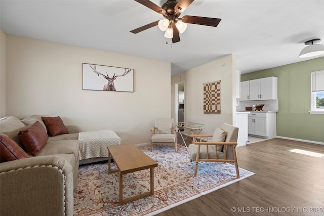 321 NE Elmhurst Ave, Bartlesville, OK 74006 - living room with light wood-style flooring and a ceiling fan