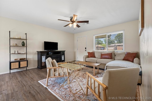 321 NE Elmhurst Ave, Bartlesville, OK 74006 - living area with wood finished floors and ceiling fan