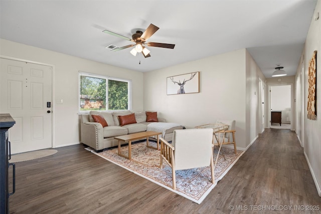 321 NE Elmhurst Ave, Bartlesville, OK 74006 - living area featuring dark wood-type flooring and a ceiling fan