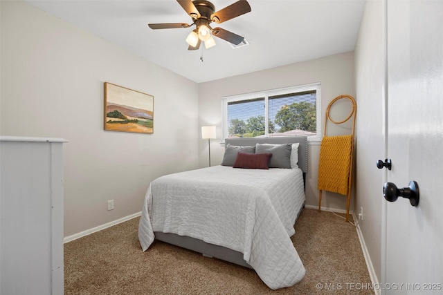 321 NE Elmhurst Ave, Bartlesville, OK 74006 - carpeted bedroom with baseboards and ceiling fan