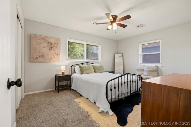 321 NE Elmhurst Ave, Bartlesville, OK 74006 - carpeted bedroom with baseboards and ceiling fan